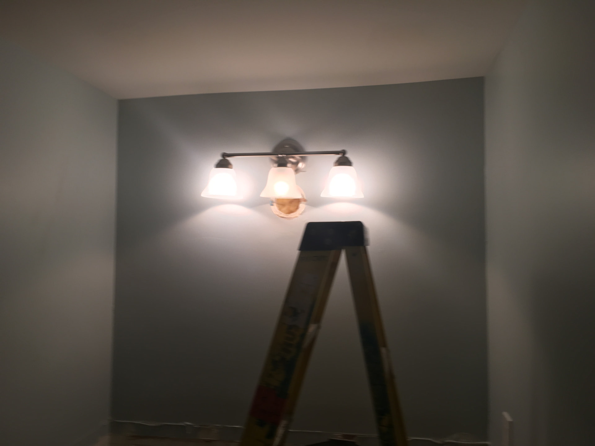 New three-light vanity fixture installed and tested
