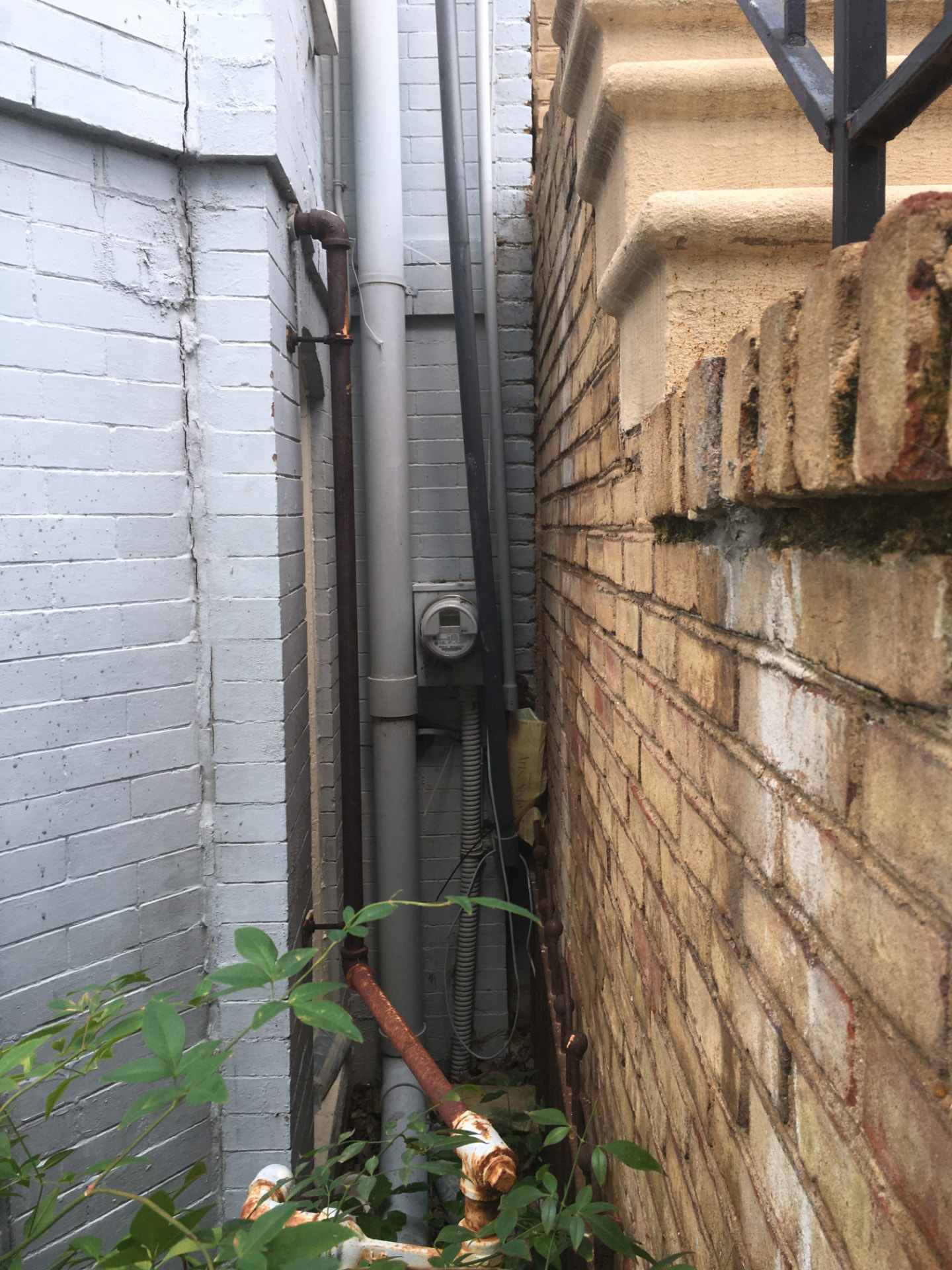 Exterior electric meter and service entrance on a brick home